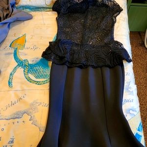 Elegant 2 piece outfit skirt is long and top is sheer.